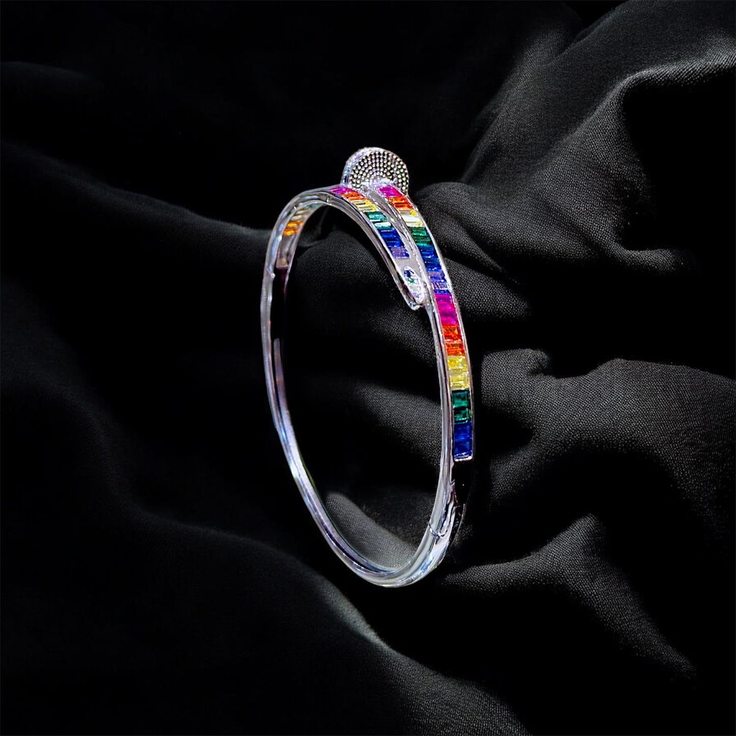 Rainbow bracelet on a black fabric background