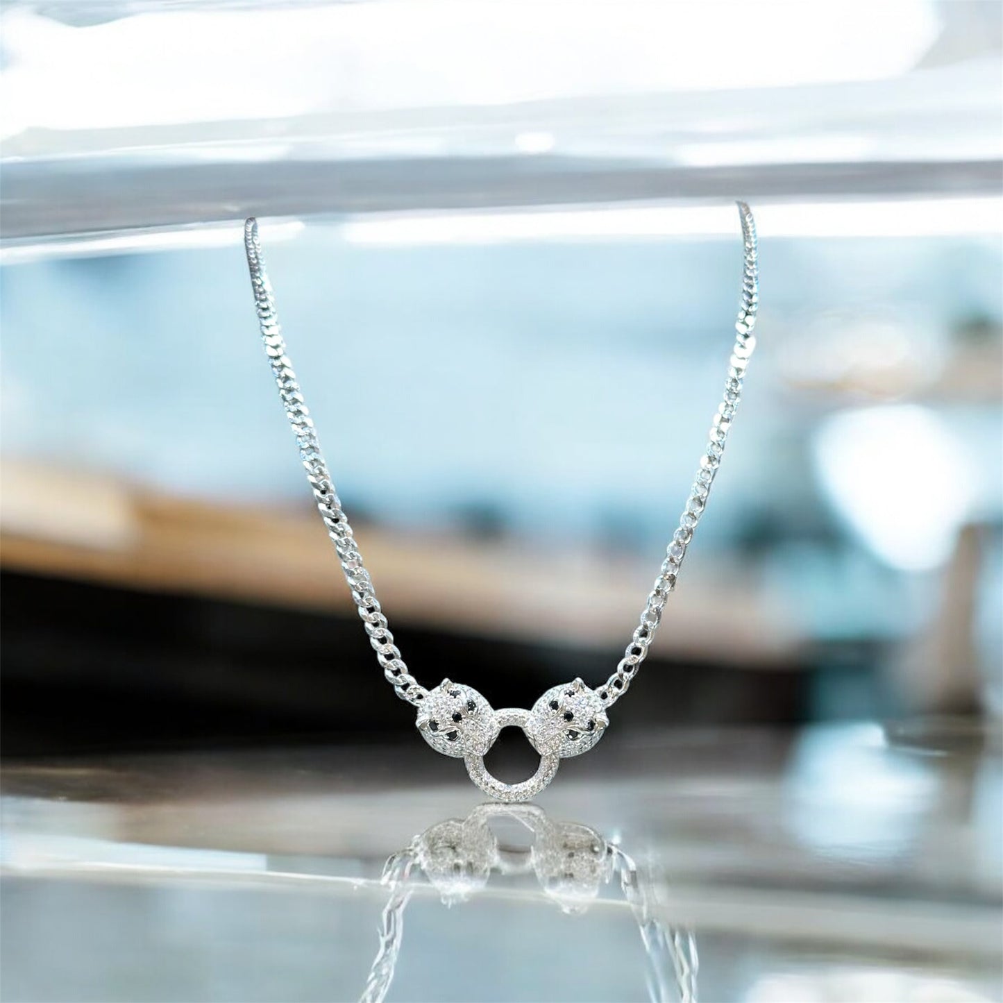 Twin Panther Embrace Chain Locket