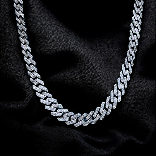 Silver chain necklace on a black fabric background