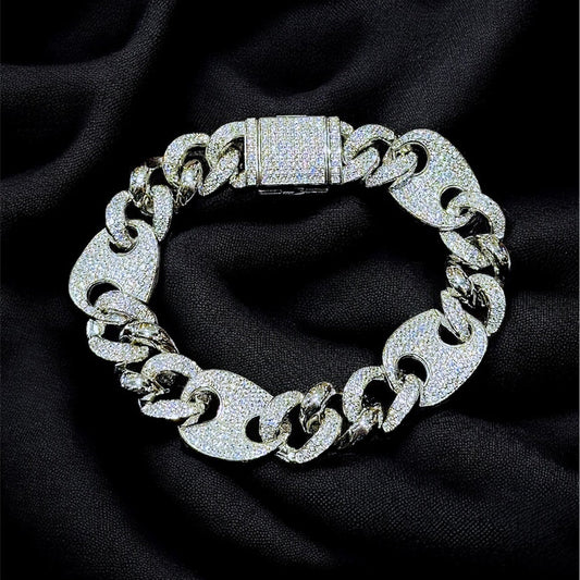 Silver chain bracelet on a dark fabric background