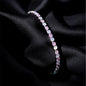 Multicolored beaded bracelet on a black fabric background