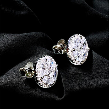 Pair of diamond earrings on a black background
