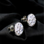 Pair of diamond earrings on a black background
