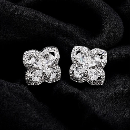 Diamond earrings on a black fabric background