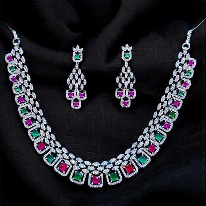 Jewelry set with necklace and earrings on a black fabric background