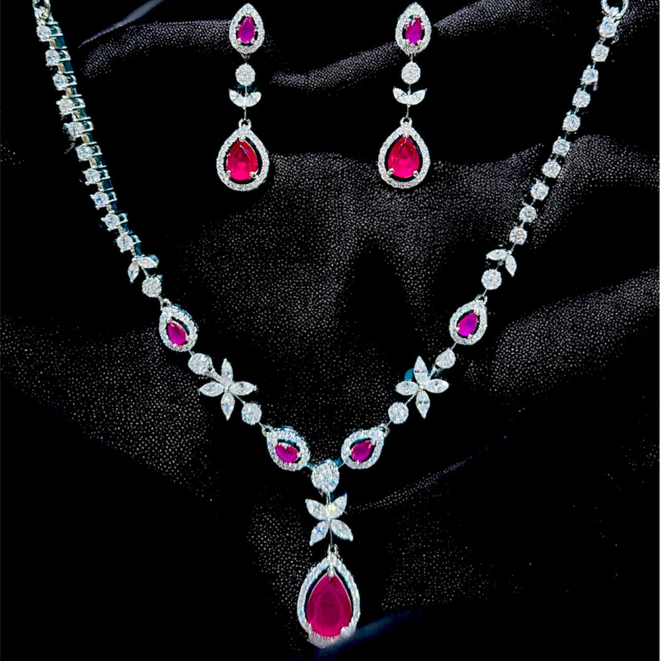 Jewelry set with necklace and earrings on a black background