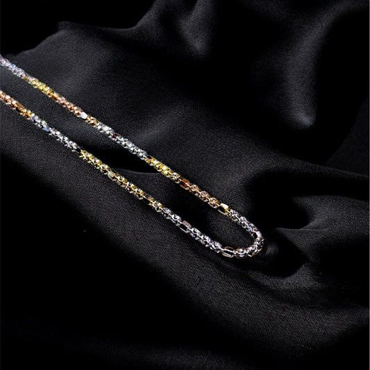 Multicolored chain necklace on black fabric