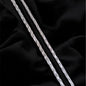 Silver chain on a black fabric background